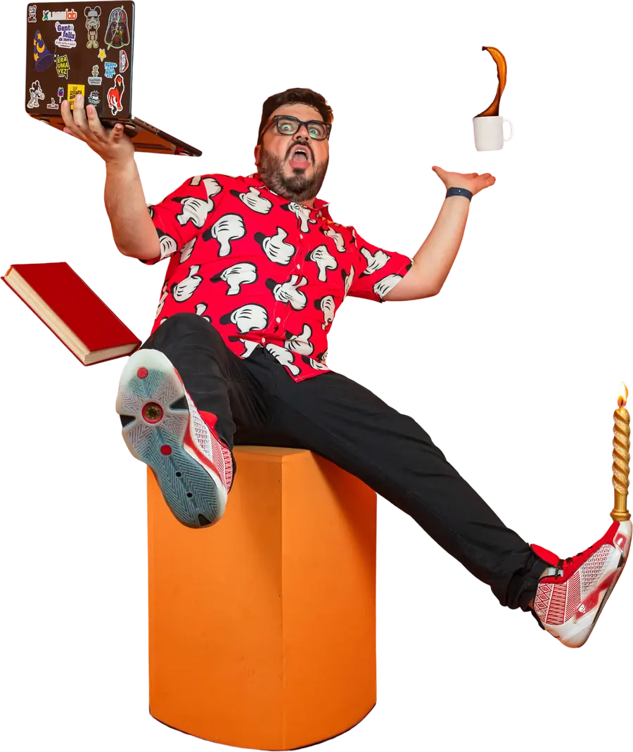 Bruno UAU equilibrando um notebook, um livro e uma xícara em cima de um pufe